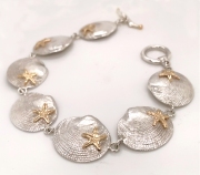 Ss and 14k gold clamshell and starfish bracelet bracelet